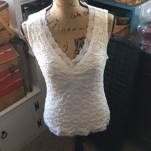 Form-fitting cream laced tank
